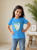 Smiling Girl in Blue Among Blooms