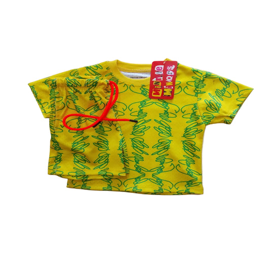 A yellow short-sleeve crop top for kids, featuring a green abstract line pattern, a red drawstring, and a red 'Crazy Style' brand tag, laid flat on a light wood background.